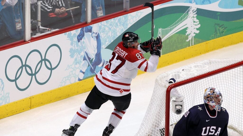 VANCOUVER, BC - FEBRUARY 28: Sidney Crosby #87 of Canada starts to celebrate after scoring the game-winning goal in overtime against Ryan Miller #39 of USA in the ice hockey men's gold medal game between USA and Canada on day 17 of the Vancouver 2010 Winter Olympics at Canada Hockey Place on February 28, 2010 in Vancouver, Canada. Canada defeated USA 3-2 in overtime. (Photo by Alex Livesey/Getty Images)