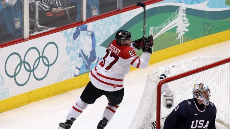 VANCOUVER, BC - FEBRUARY 28: Sidney Crosby #87 of Canada starts to celebrate after scoring the game-winning goal in overtime against Ryan Miller #39 of USA in the ice hockey men's gold medal game between USA and Canada on day 17 of the Vancouver 2010 Winter Olympics at Canada Hockey Place on February 28, 2010 in Vancouver, Canada. Canada defeated USA 3-2 in overtime. (Photo by Alex Livesey/Getty Images)