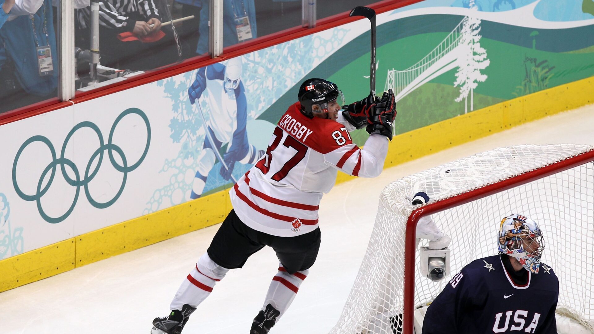 VANCOUVER, BC - FEBRUARY 28: Sidney Crosby #87 of Canada starts to celebrate after scoring the game-winning goal in overtime against Ryan Miller #39 of USA in the ice hockey men's gold medal game between USA and Canada on day 17 of the Vancouver 2010 Winter Olympics at Canada Hockey Place on February 28, 2010 in Vancouver, Canada. Canada defeated USA 3-2 in overtime. (Photo by Alex Livesey/Getty Images)
